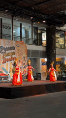 Traditional Balinese dancers perform in red costumes in Kuta
