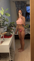 Woman takes mirror selfie in tie-dye outfit in Russia