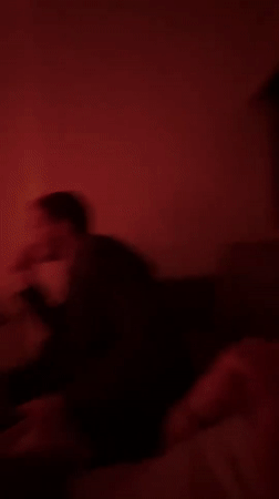 Two people filmed under red lighting in Mexico City
