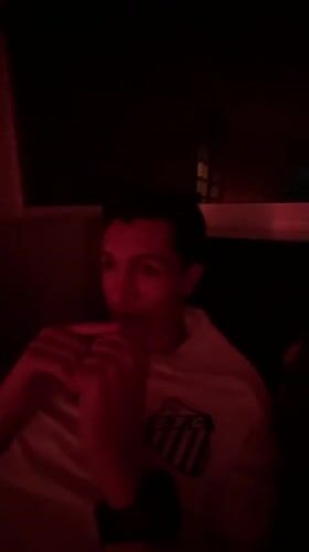 Two people filmed under red lighting in Mexico City