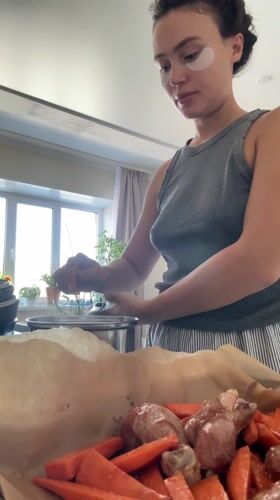 Woman cooking in kitchen captured in Surgut, Russia