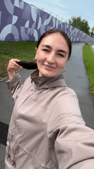 Woman films plane overhead in Sirius, Russia residential area