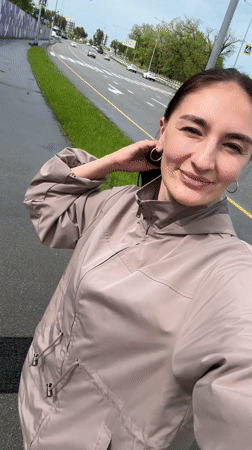 Woman films plane overhead in Sirius, Russia residential area
