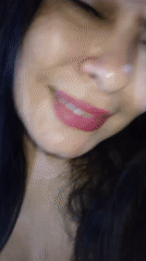 Woman poses for selfies and videos in indoor setting