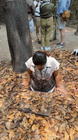 Woman enters concealed underground tunnel in Ho Chi Minh City