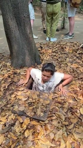 Woman enters concealed underground tunnel in Ho Chi Minh City