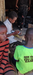 Children practice traditional shoemaking crafts in Jos, Nigeria