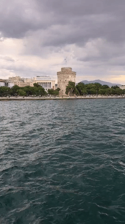Thessaloniki's White Tower seen from the water on a cloudy day