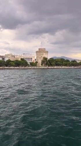 Thessaloniki's White Tower seen from the water on a cloudy day