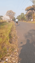 Morning street life: joggers, a traffic officer, and a bench