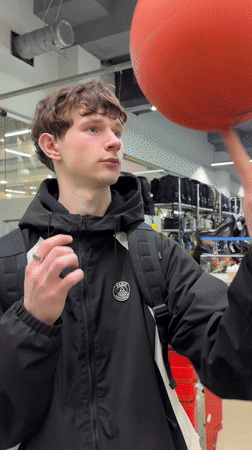 Young man visits sporting goods store in Izhevsk