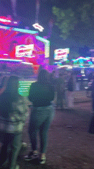 Small nighttime carnival operates in Parvomai, Bulgaria