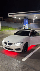 White BMW with neon lights spotted at Arica gas station