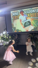 Kids dancing at a lit-up indoor event in Perm