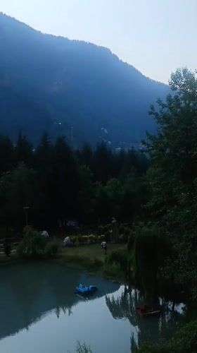 Tourist captures scenic Manali landscapes and traditional architecture