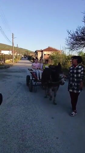 Children play and dance in Bulgarian village streets