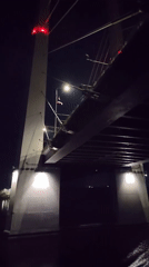 October Bridge illuminated at night in Cherepovets, Russia