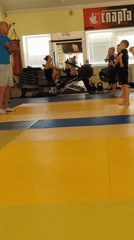 Children's judo training session captured at Chaikovsky gymnasium