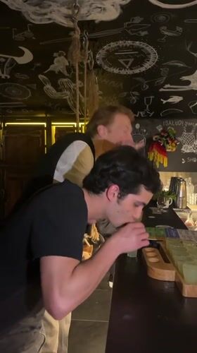 Young men share drinks at Lyon bar Thursday evening