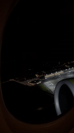 Passenger captures nighttime aerial view of Vienna's Schwechat Airport