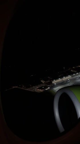 Passenger captures nighttime aerial view of Vienna's Schwechat Airport