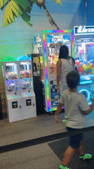 Arcade claw machines and prize setups at a Buffalo Grove venue