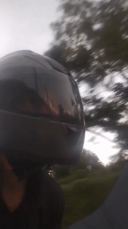 Evening motorcycle ride through Ko Kaeo's palm-lined roads at sunset
