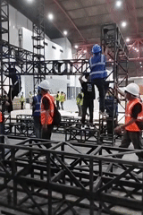 Convention center build-out underway in Jakarta, scooters parked outside