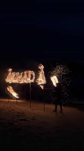 Fire performers stage nighttime beach show in Thailand