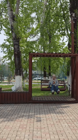 Woman on swing, craftsman mural spotted in Birobidzhan