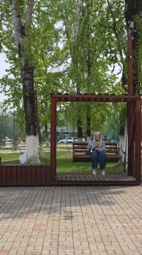 Woman on swing, craftsman mural spotted in Birobidzhan