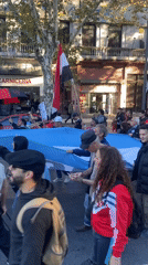 Street demonstration with Argentine flag marches through Buenos Aires