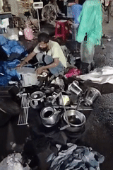 Afternoon to evening street life along a busy Dhaka corridor