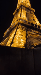 Nighttime Documentation of Illuminated Eiffel Tower from Ground Level