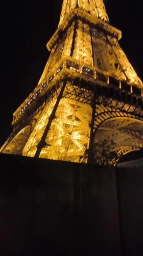 Nighttime Documentation of Illuminated Eiffel Tower from Ground Level