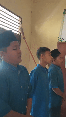 Three students photographed together in Blangriek classroom setting