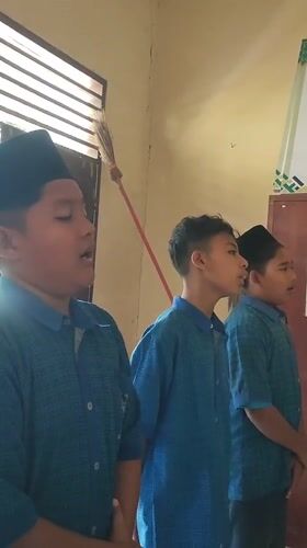 Three students photographed together in Blangriek classroom setting