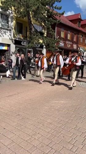 Folk costume marching band parades through central Zakopane