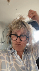 Woman with glasses observed in bathroom, Chambœuf France