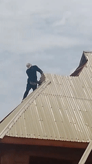 Man replaces metal roof panels with white materials