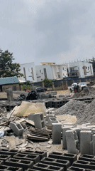 Concrete block production underway at an Abuja construction site