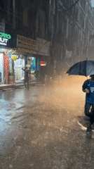 Heavy Rain Floods Dhaka Streets, Rickshaw Navigates Waterlogged Roads