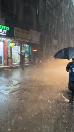 Heavy Rain Floods Dhaka Streets, Rickshaw Navigates Waterlogged Roads