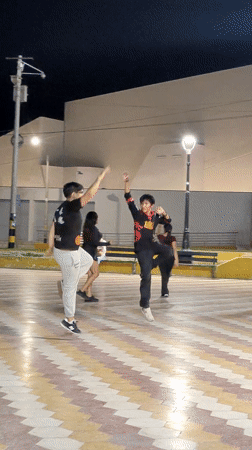 Night dancing gathering observed near Tacna's iconic arch