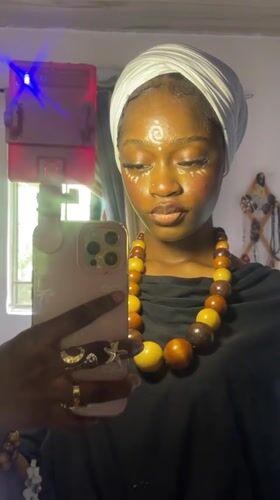Woman documents traditional face paint ceremony in Ado, Nigeria