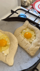 Georgian khachapuri preparation and serving in Milan kitchen