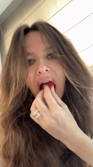 Woman enjoys strawberries, does dishes in early morning Khimki
