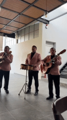 Musical trio in pink blazers performs at Mexican venue