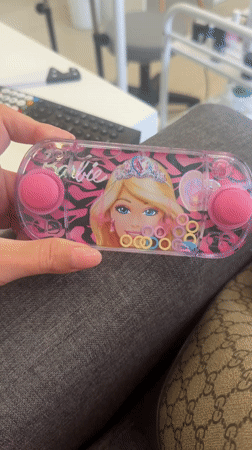 Person plays Barbie water game near Lion's Head, Cape Town