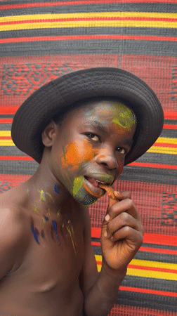 Face painting session with vibrant colors in Ado